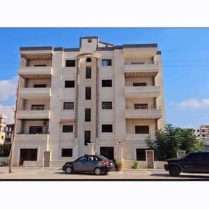 السعر لكامل العرض 4 شقق سكنية على العضم  بالاضافة لمحل مؤلف من طابقين مكسيالموقع توسع العاشر على المتحلق
